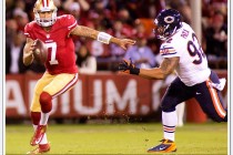 49er quarterback Colin Kaepernick eludes a Chicago Bear defender on Monday Night football - 11/19/2012