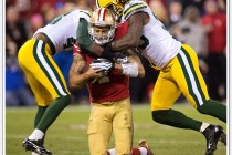 49ers quarterback Colin Kaepernick is double teamed by Green Bay Packer defenders