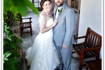 Bride and groom pose for photo after first look