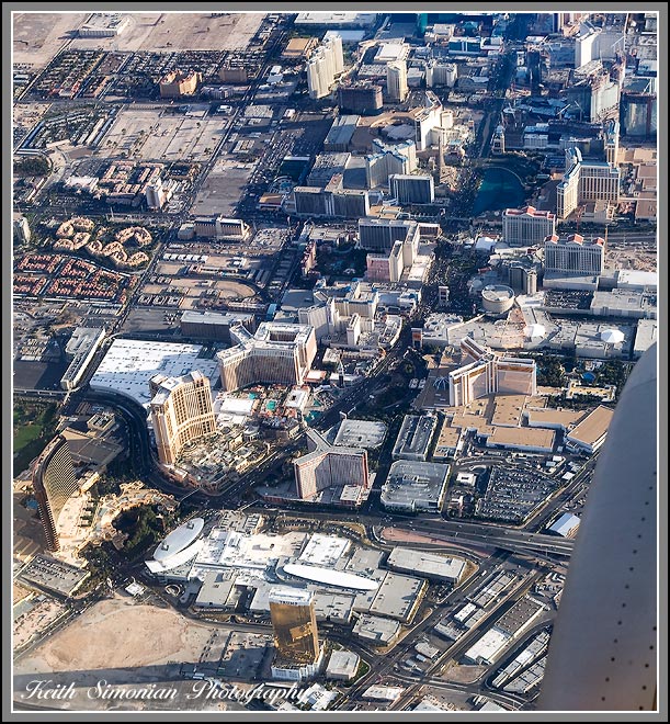 Arial view of Las Vegas Strip - Left Side Hotels: Wynn, Palazzo, Venetian, Ballys, Paris. Right Side Hotels: Caesars Palace, Treasure Island, Trump Casino, Bellagio, and the Mirage.