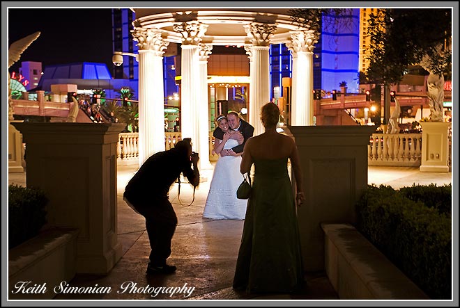 Bride and groom wedding photographer and bridesmaid take pictures