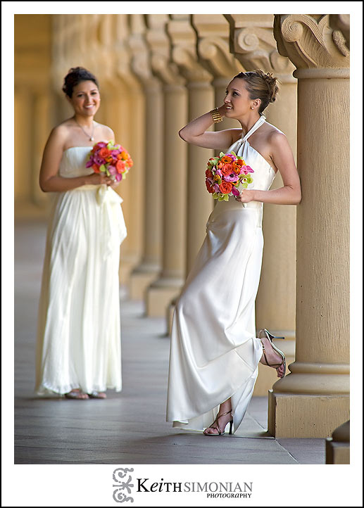 The Brides pose outside the church by the columns