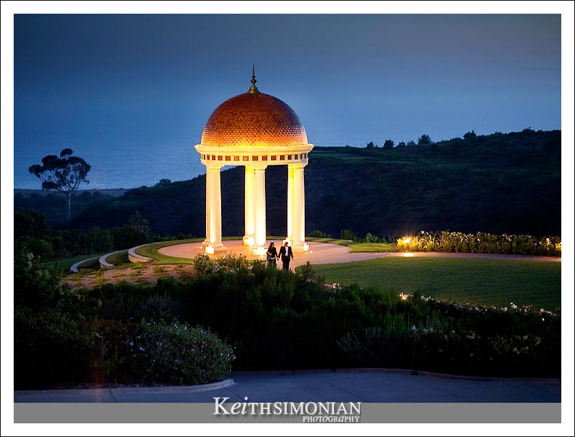 Night view of the rotunda and the Pacific Ocean in the background