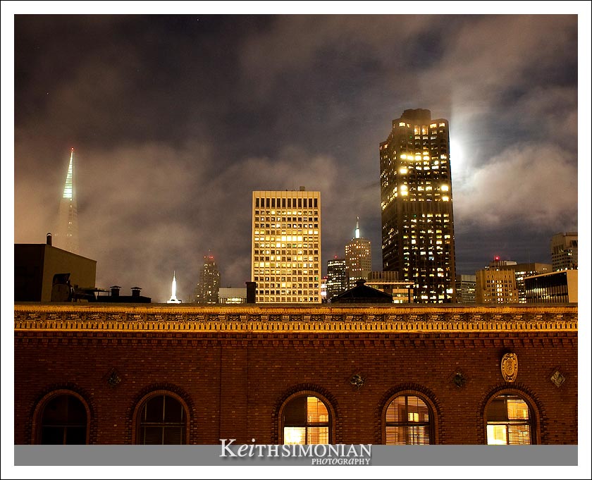 The fog lifts enough so that guests can view the Transamerica pyramid and Bank of America building