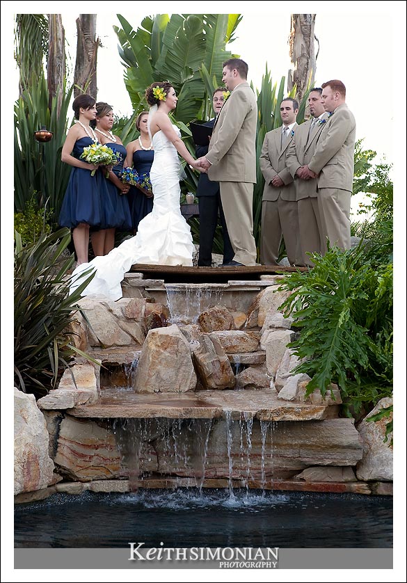 The wedding ceremony takes place over the waterfall
