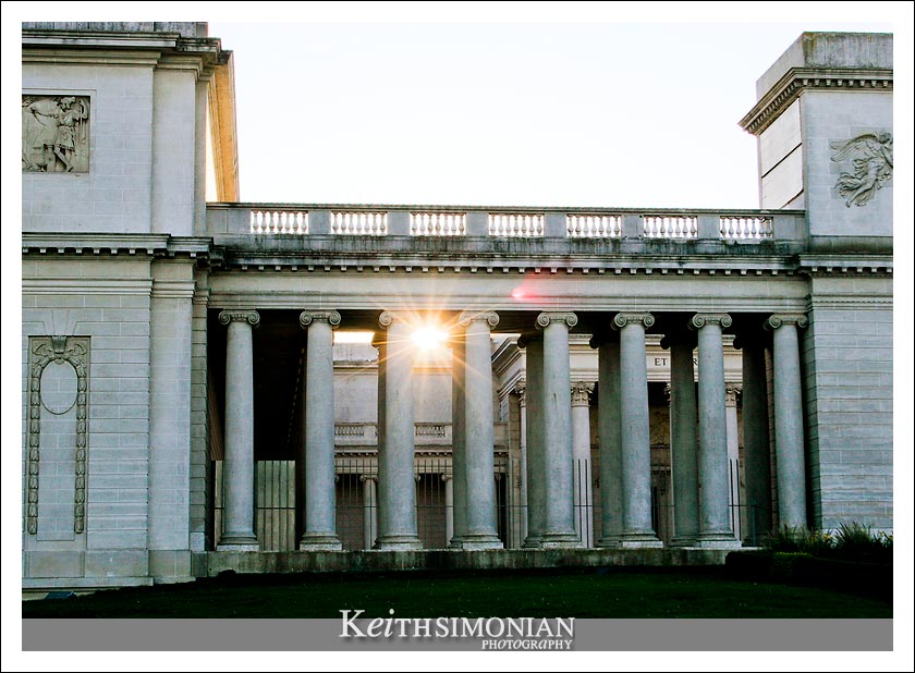 The last rays of sunlight pass through the columns of the palace which is a three-quarters scale replica of the Palais de la LÃ©gion d'Honneur in Paris 