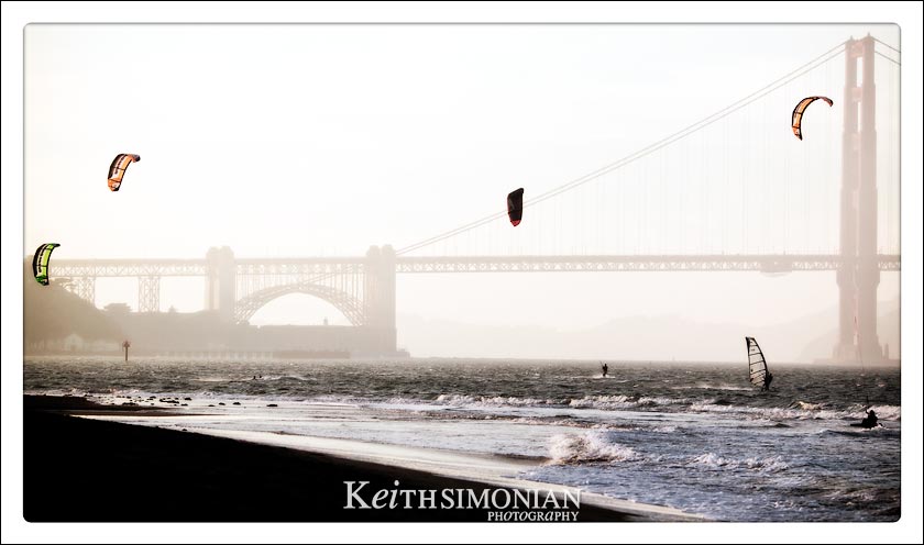 Kite surfing and Wind surfers with Golden Gate Bridge in background