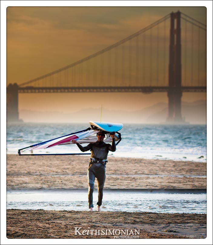 Wind Surfer calling it a day with a sunset over the Golden Gate Bridge
