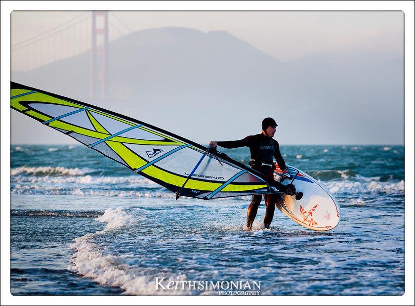 Wind surfer heading out into the San Francisco Bay from Chrissy field