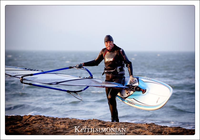 As the sun sets over the San Francisco Bay this young at heart wind surfer calls it a day