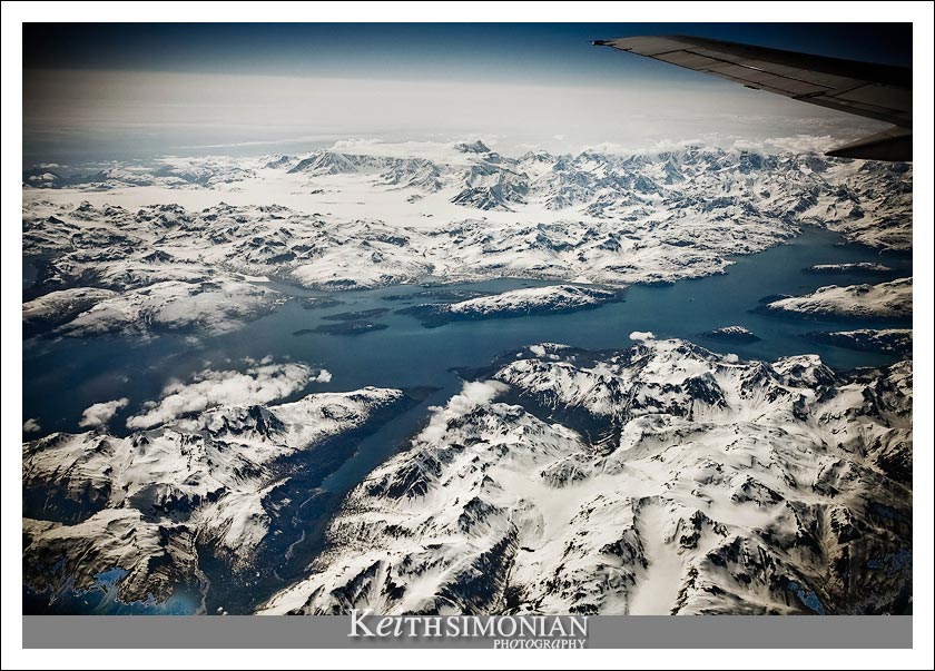 Alaskan mountains seen from an altitude of 39,000 feet from the window of a Alaska Airline Boeing 737-800