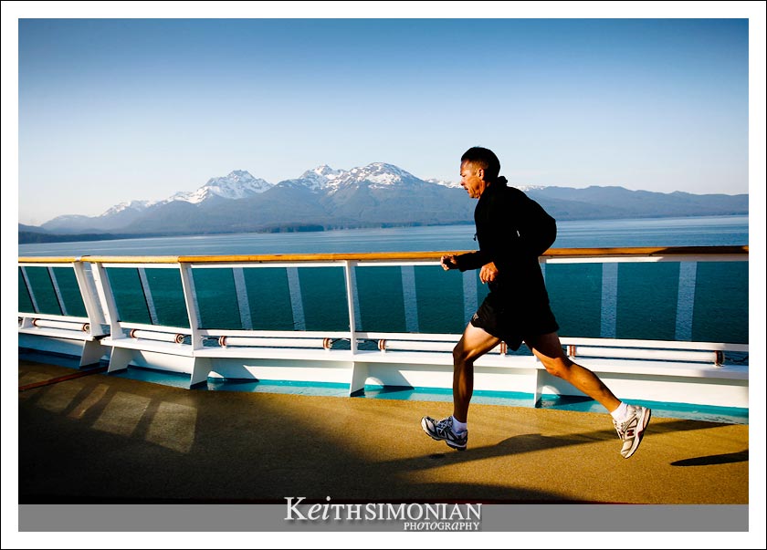 A guest of the Radiance of the Seas takes in the amazing sites while using the 12 deck jogging tracking to stay in shape