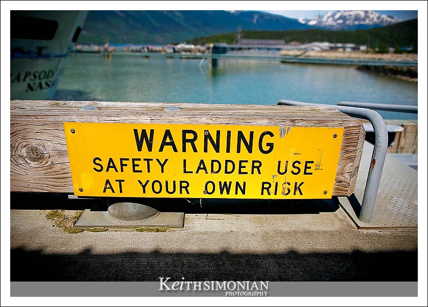 The sign in the photo says - Warning Safety Ladder - use at your own risk