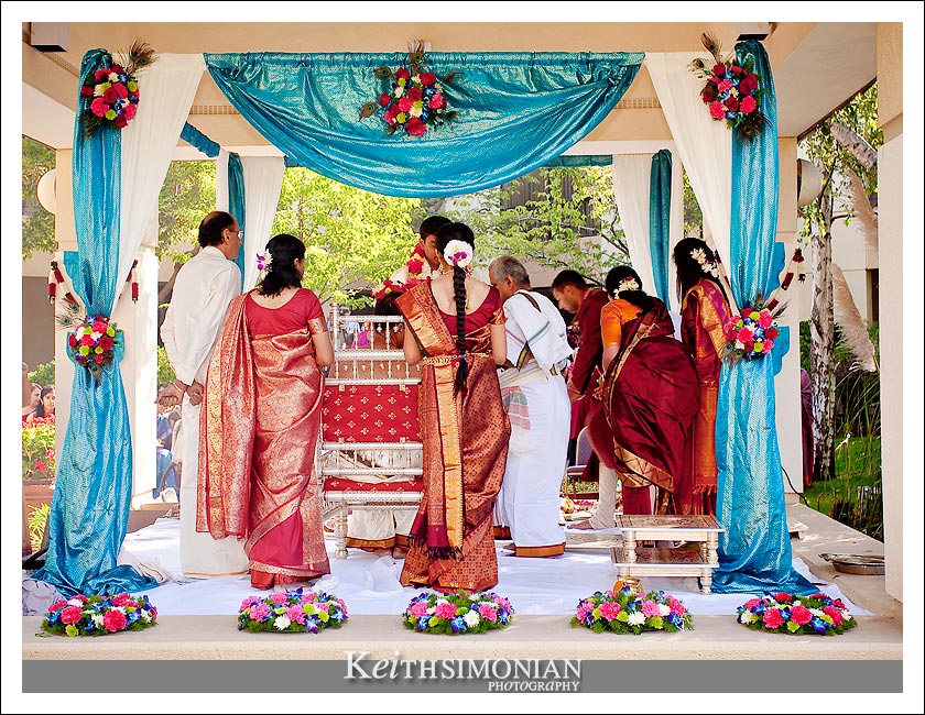 Bride and groom under 4 pillar mandap