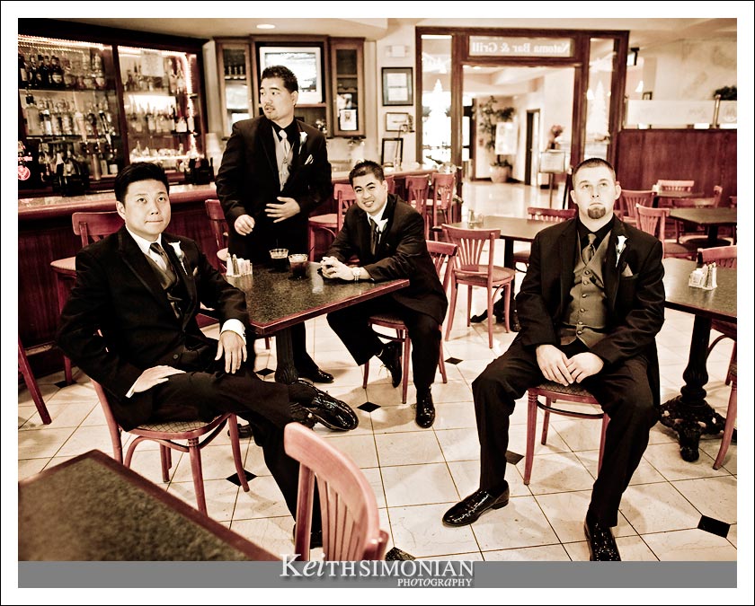 Groom and groomsmen waiting in the bar - black and white photo