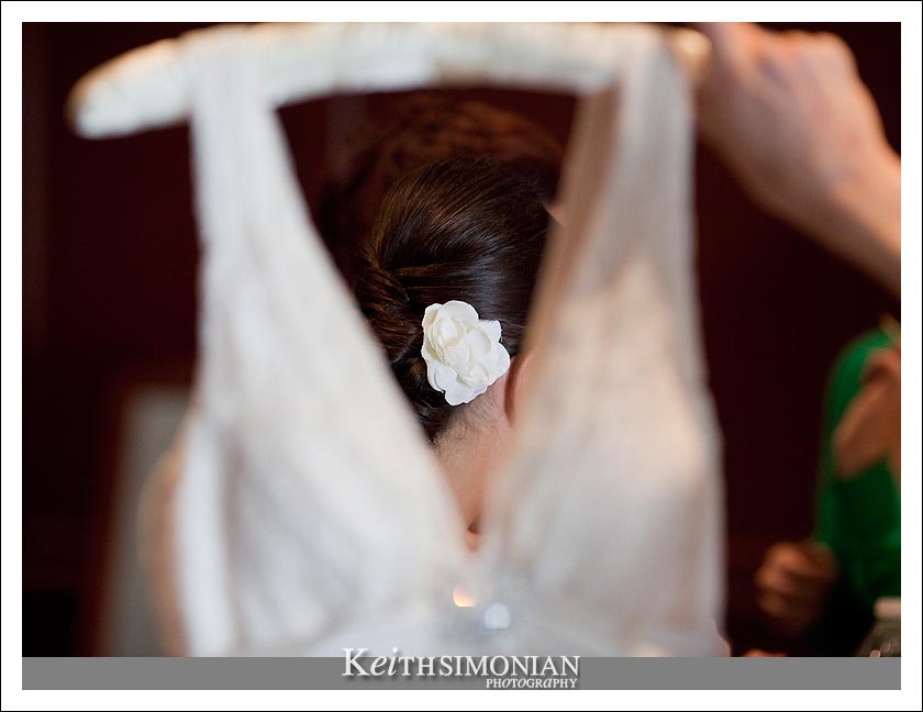 Bride getting ready with flower in her hair