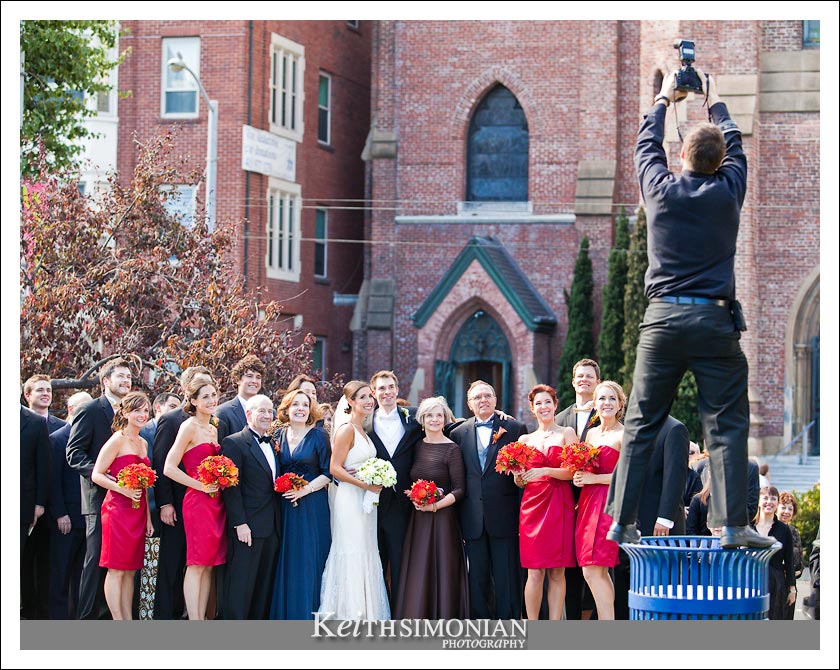 Photo of wedding photographer taking a group photo