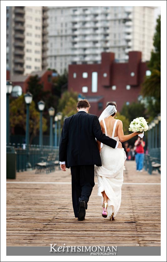 Bride and groom in photo with the San Francisco skyline in the background