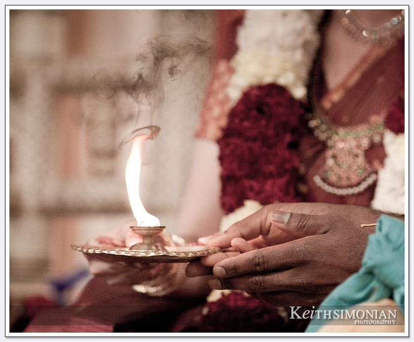 During the South Indian Hindu wedding ceremony the bride and groom hold the flame at the Shiva-Vishnu Temple in Livermore, California