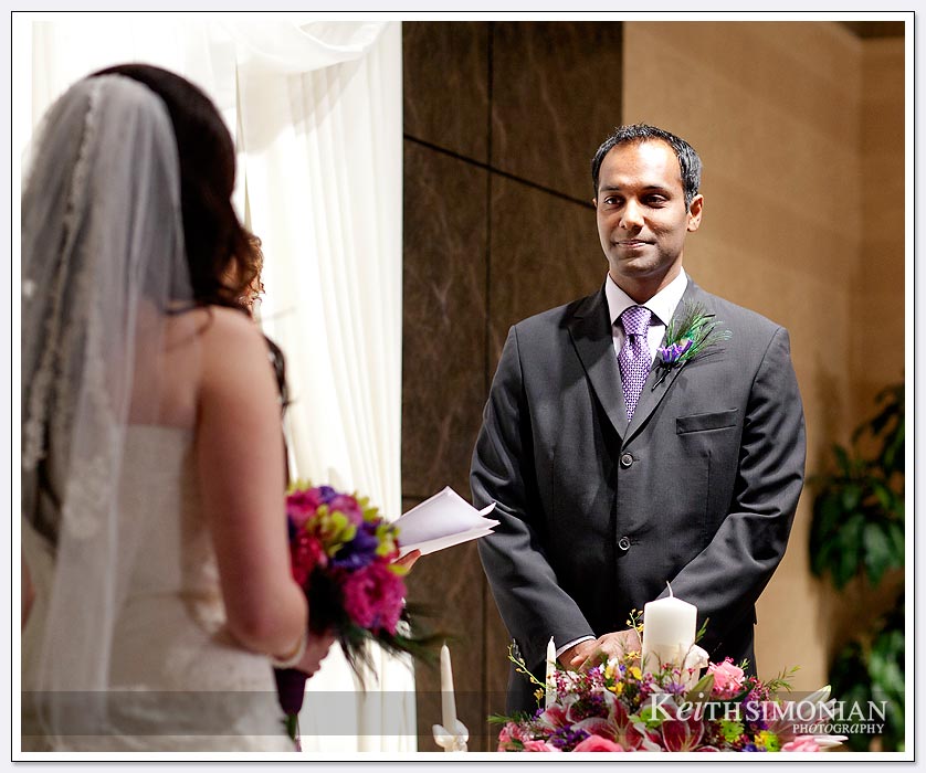 The Groom faces the bride to be during the wedding ceremony at the Newark-Fremont Hilton Hotel