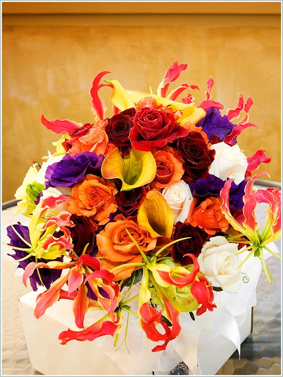 Red, yellow, blue and white flowers in the bouquet
