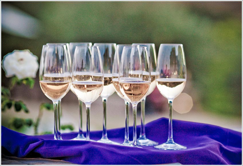 Wine glasses with champagne at sunset
