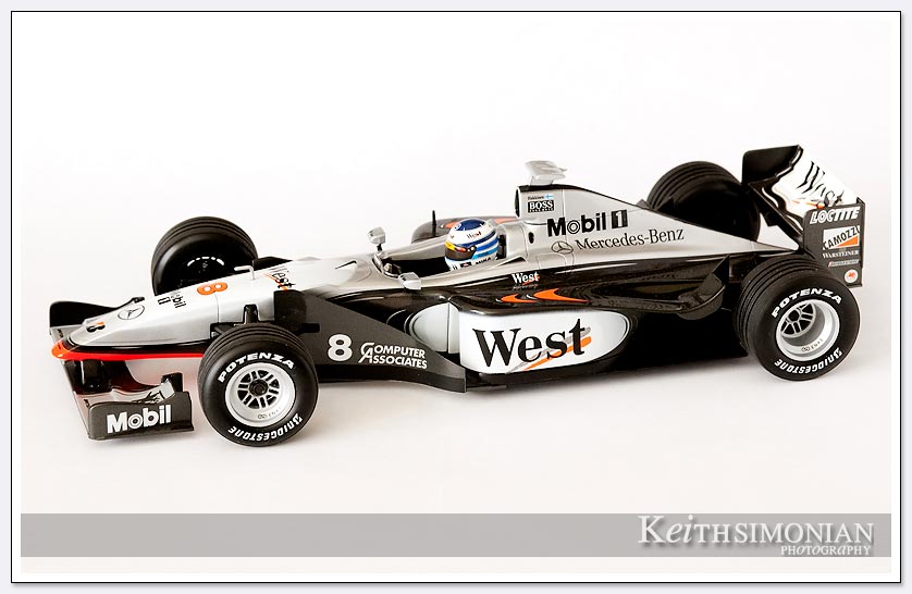 Photo of #8 West McLaren with black and silver coloring driven by Mika Hakkinen