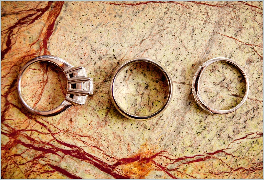 Bride and groom's rings on stone tile photo