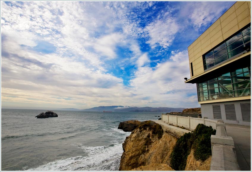 Cliff house photo with clouds