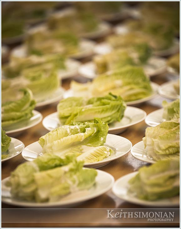 Salad is served to wedding guests