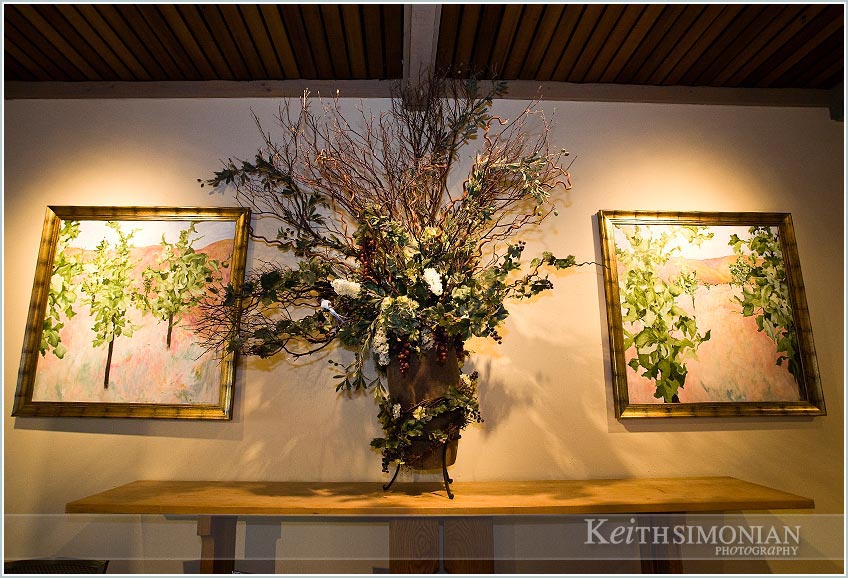 paintings and flowers in the reception site