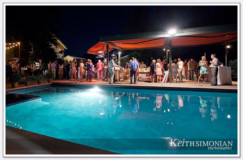 A nice evening breeze and a swimming pool as a backdrop make for a wonderful backyard outdoor wedding reception