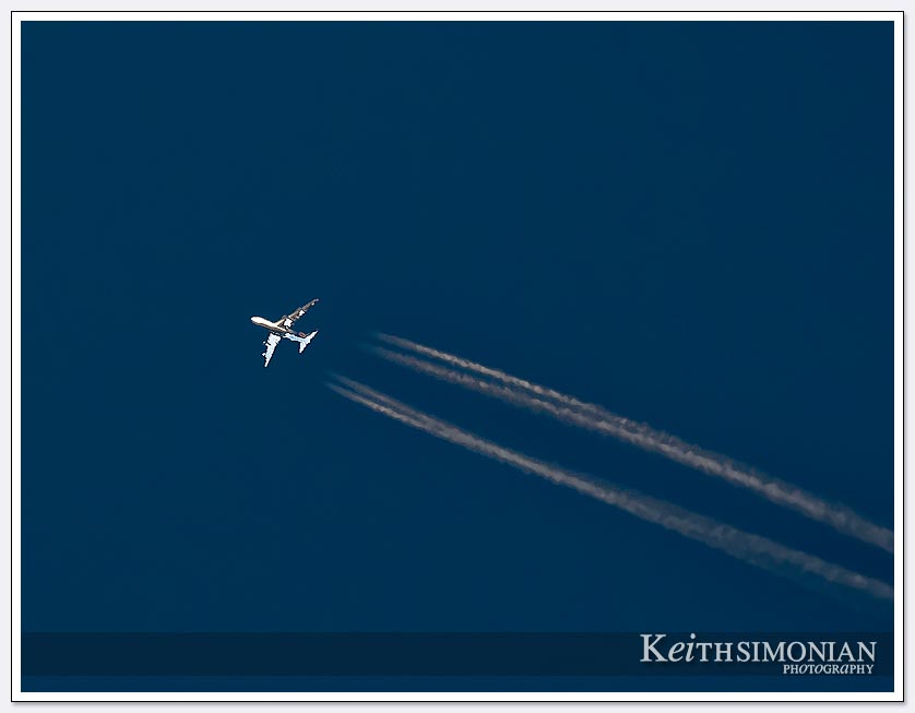 This early morning flight of a commercial jet with 4 engines leaves contrails over the Brentwood sky
