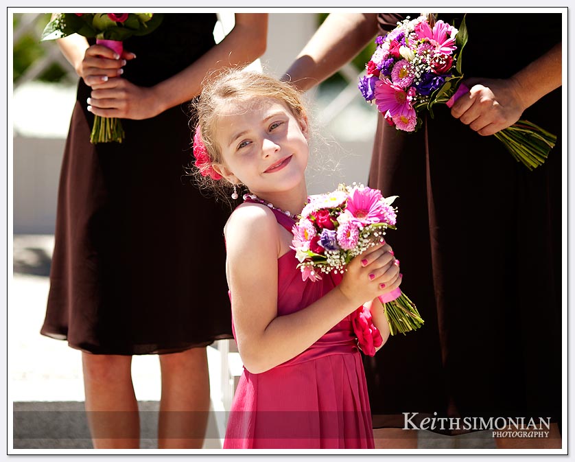 Flower girl poses with bouquet at Oakland LDS Mormon temple