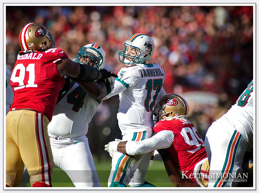 NFL sack leader San Francisco 49er #99 Aldon Smith sacks Miami Dolphin quarterback Ryan Tannehill