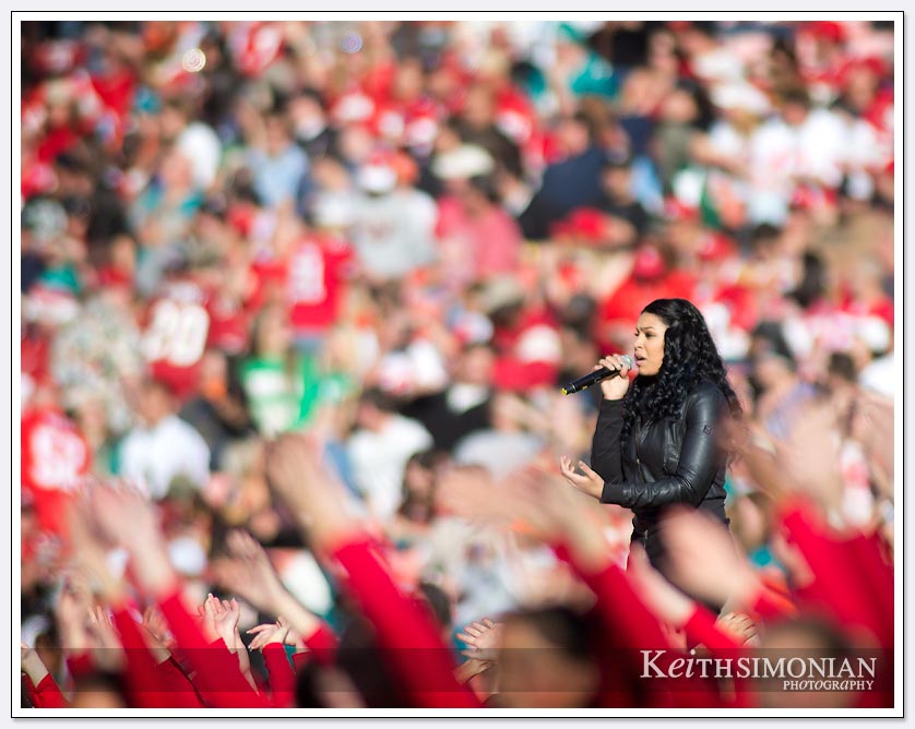 American Idol winner Jordin Sparks is surrounded by a sea of red and gold at 49ers vs Miami halftime show