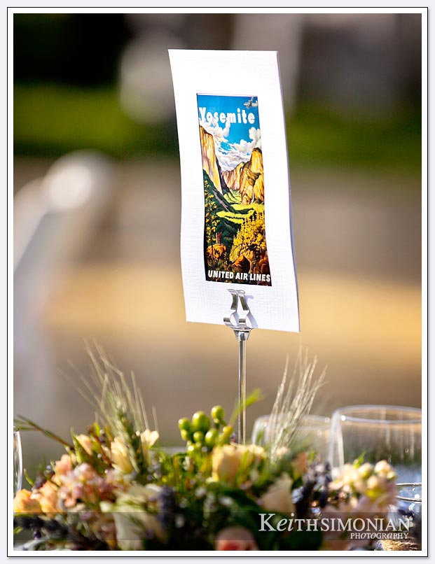 Guests at the wedding reception of place cards of famous California landmarks