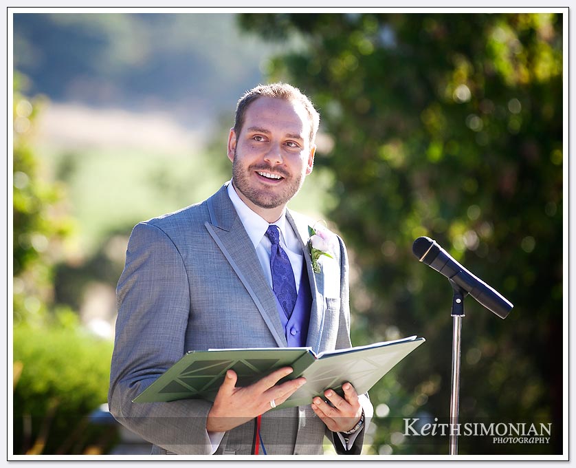 Best man reading during the wedding ceremony