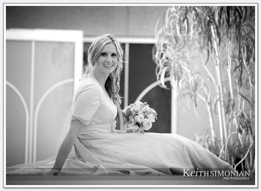 Black and white photo of Bride posing with her bouquet