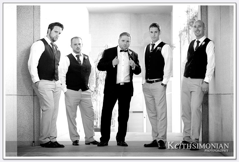 Black and white photograph of groom with groomsmen
