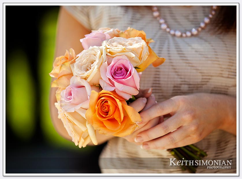 Bridesmaid bouquet with yellow, orange, and white flowers