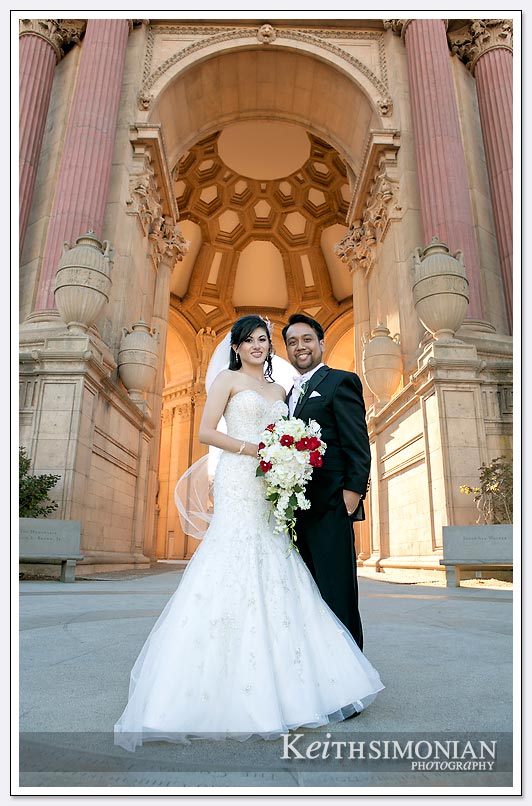 The dome of the Palace of Fine Arts in San Francisco serves as the backdrop for the Bride and Groom