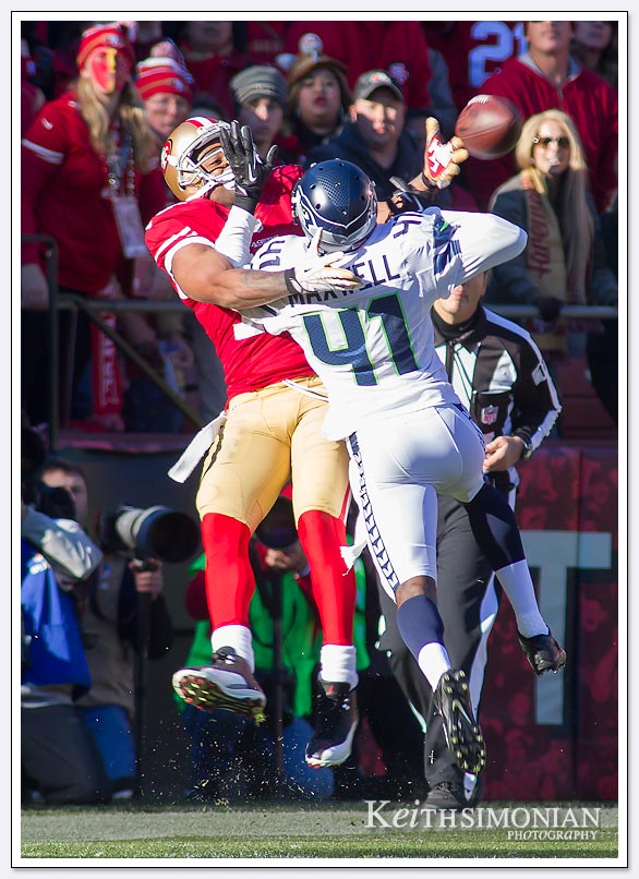 SAN FRANCISCO, CA - DECEMBER 08: Michael Crabtree #15 of the San Francisco 49ers is mugged by Bryon Maxwell #41 of the Seattle Seahawks while defending this pass during the second quarter at Candlestick Park on December 8, 2013