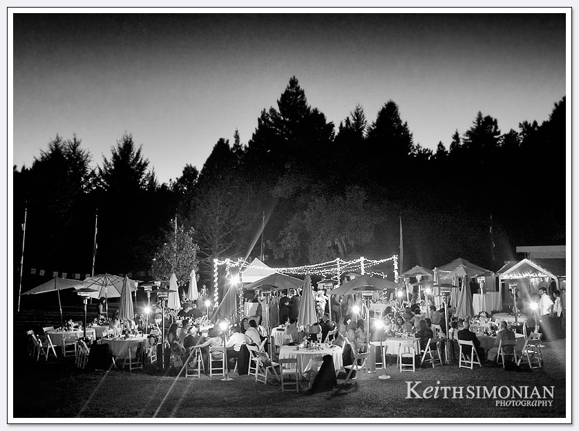 The lights twinkle during the nighttime outdoor reception at Pema Osel Ling