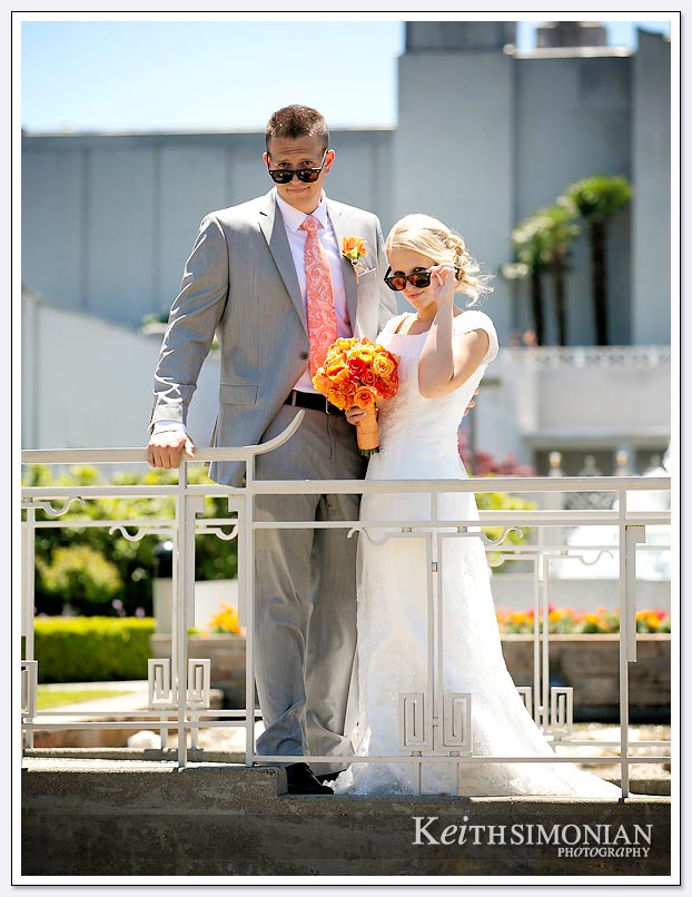 The bride and groom brought sunglasses just for photos outside the LDS Oakland temple