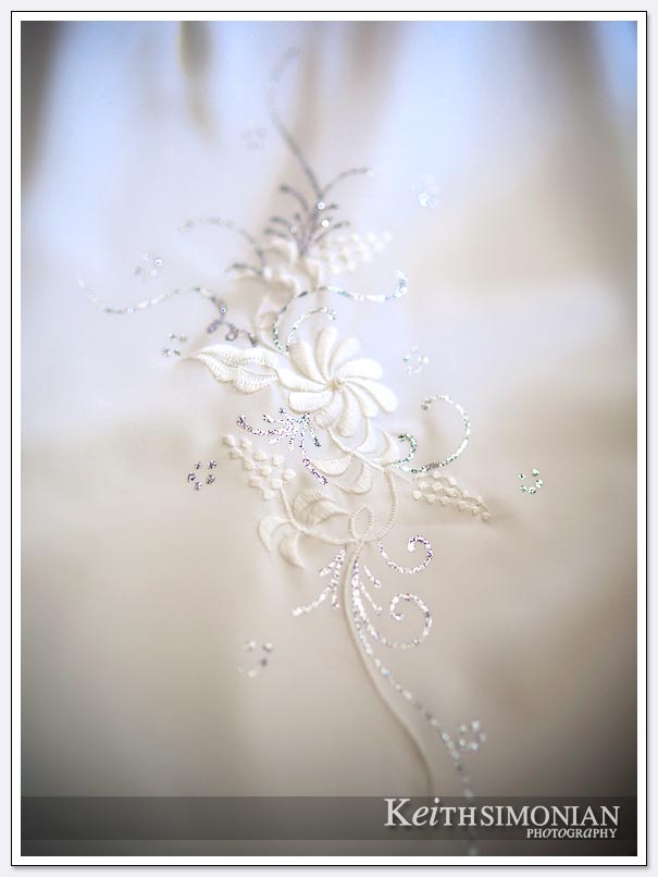 Elegant pattern of flowers on white wedding dress
