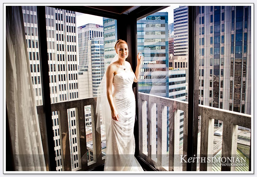 The many high rise buildings of San Francisco serve at backdrop for this bride getting ready in the Le Meridien Hotel