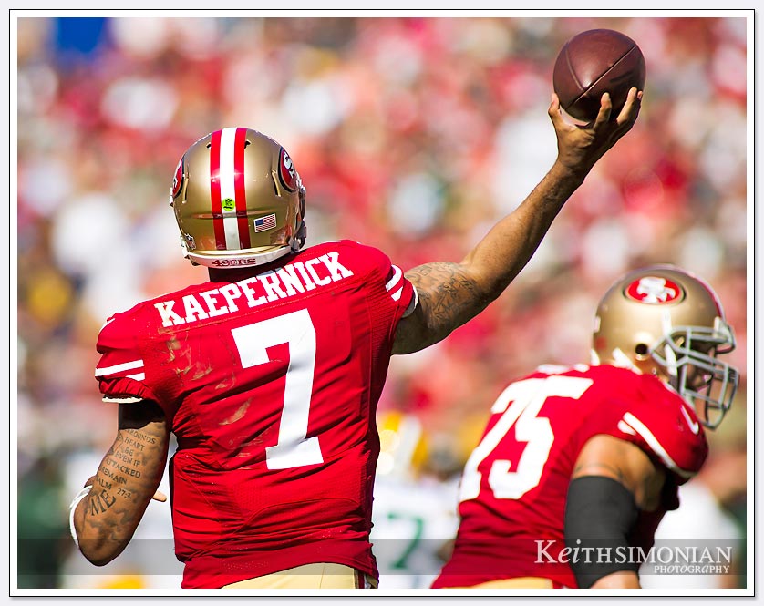 Colin Kaepernick 49er quarterback throws the ball down field against the Green Bay Packers on September 8, 2013 at Candlestick park