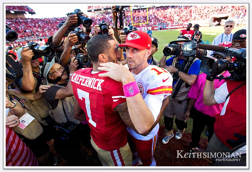 NFL football: #11 Alex Smith of the Kansas City Chiefs hugs  Colin Kaepernick #7 of the San Francisco 49ers after the 49ers won their game at Levi Stadium in Santa Clara, CA on October 5th, 2014. 