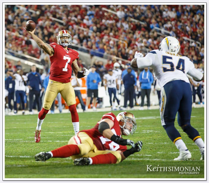 Canon-5D-Mark3-NFL-Game - San Francisco 49er quarterback Colin Kaepernick throws to the end zone against the San Diego Chargers in a rare Saturday night NFL game.